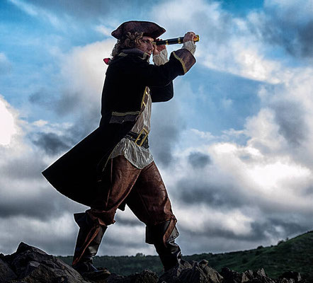 a pirate looking thru a spyglass